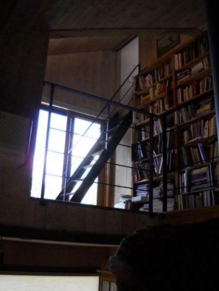 bookshelf at top of stairs