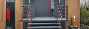 A custom railing on a staircase outside of a business