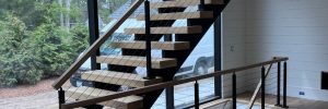Side stringer (pan-type stair) closed risers, wood treads, cable rail