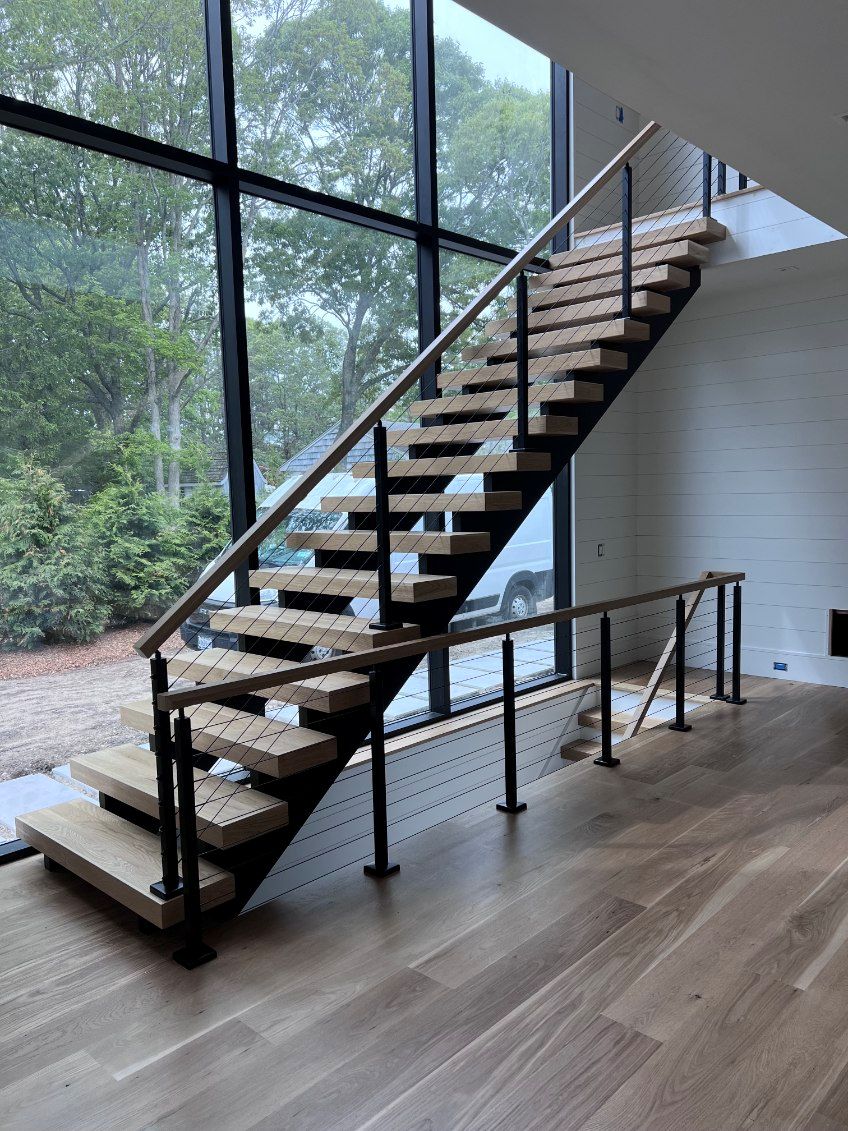 Side stringer (pan-type stair) closed risers, wood treads, cable rail