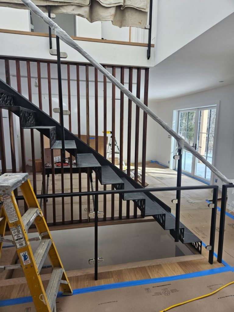 Special cantilevered side stringer, closed riser with custom cut riser design