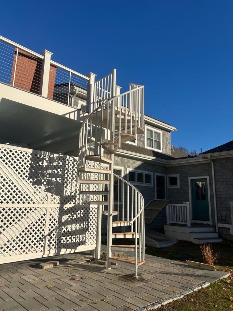 White spiral stair with wood treads by others