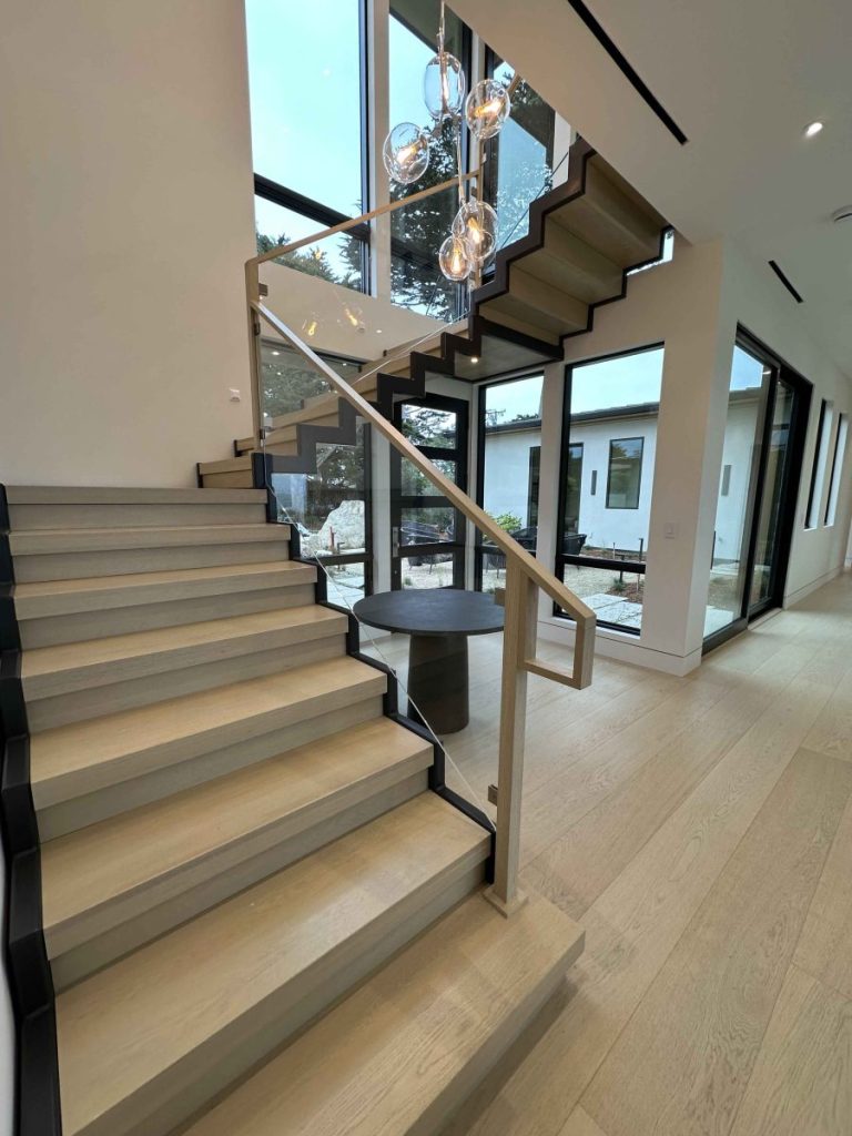 Z-Stringer stairs, closed riser, rails made for glass panels by others